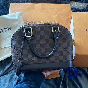 Louis Vuitton Alma BB Purse With the strap .